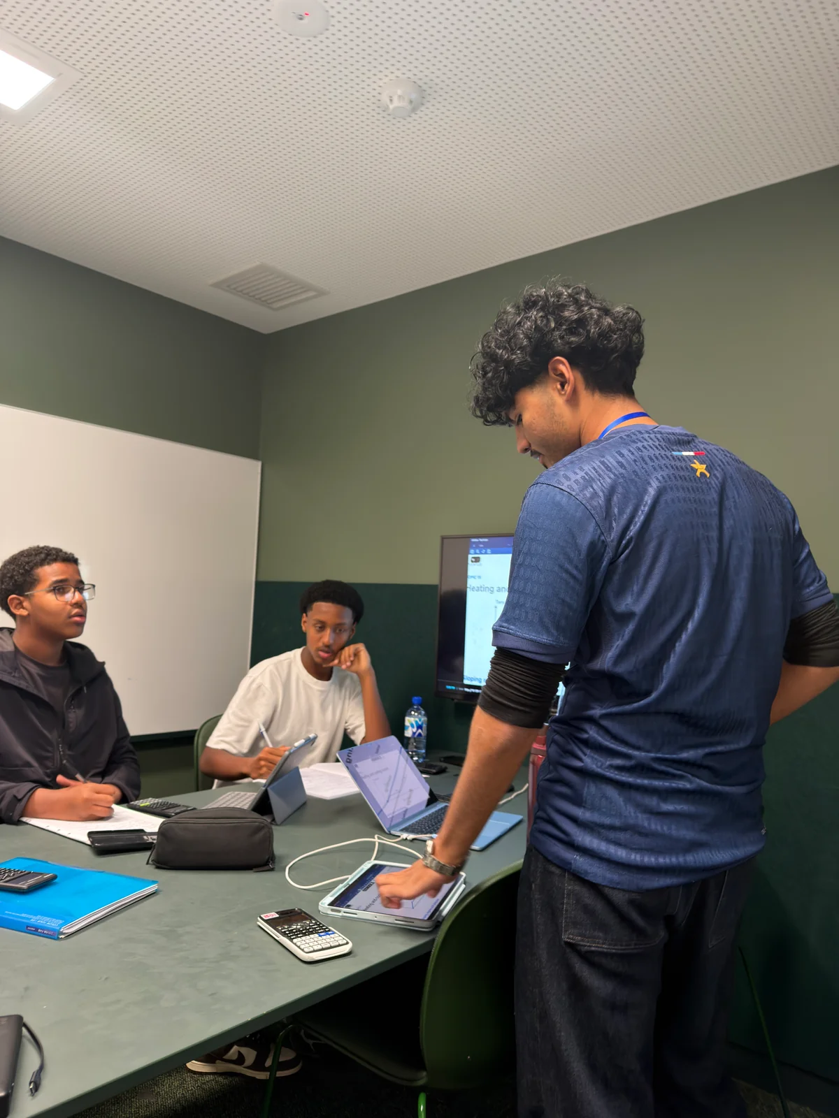 Safwan helping ATAR students with their work
