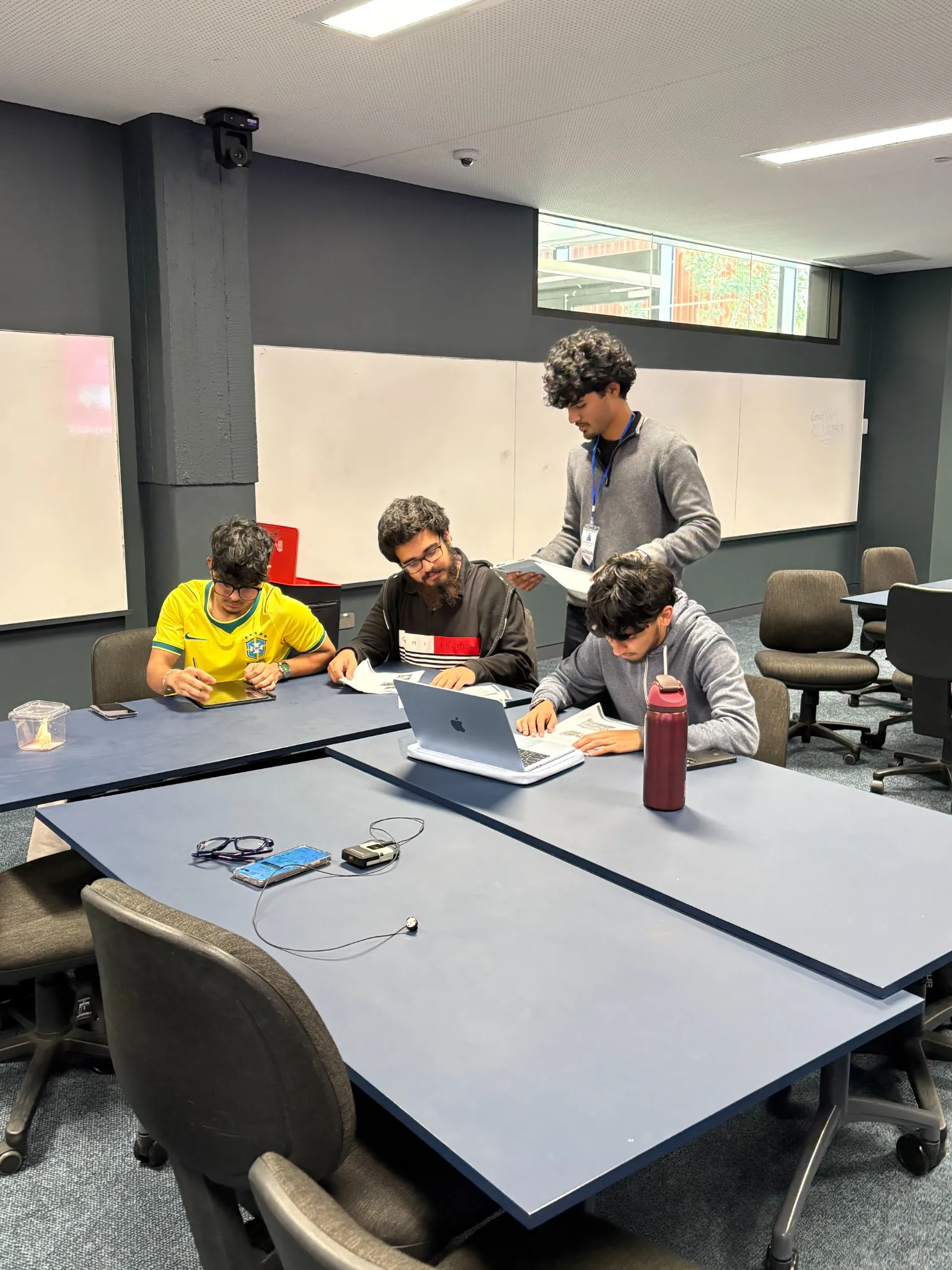 Aventus tutor supporting students in a small group classroom