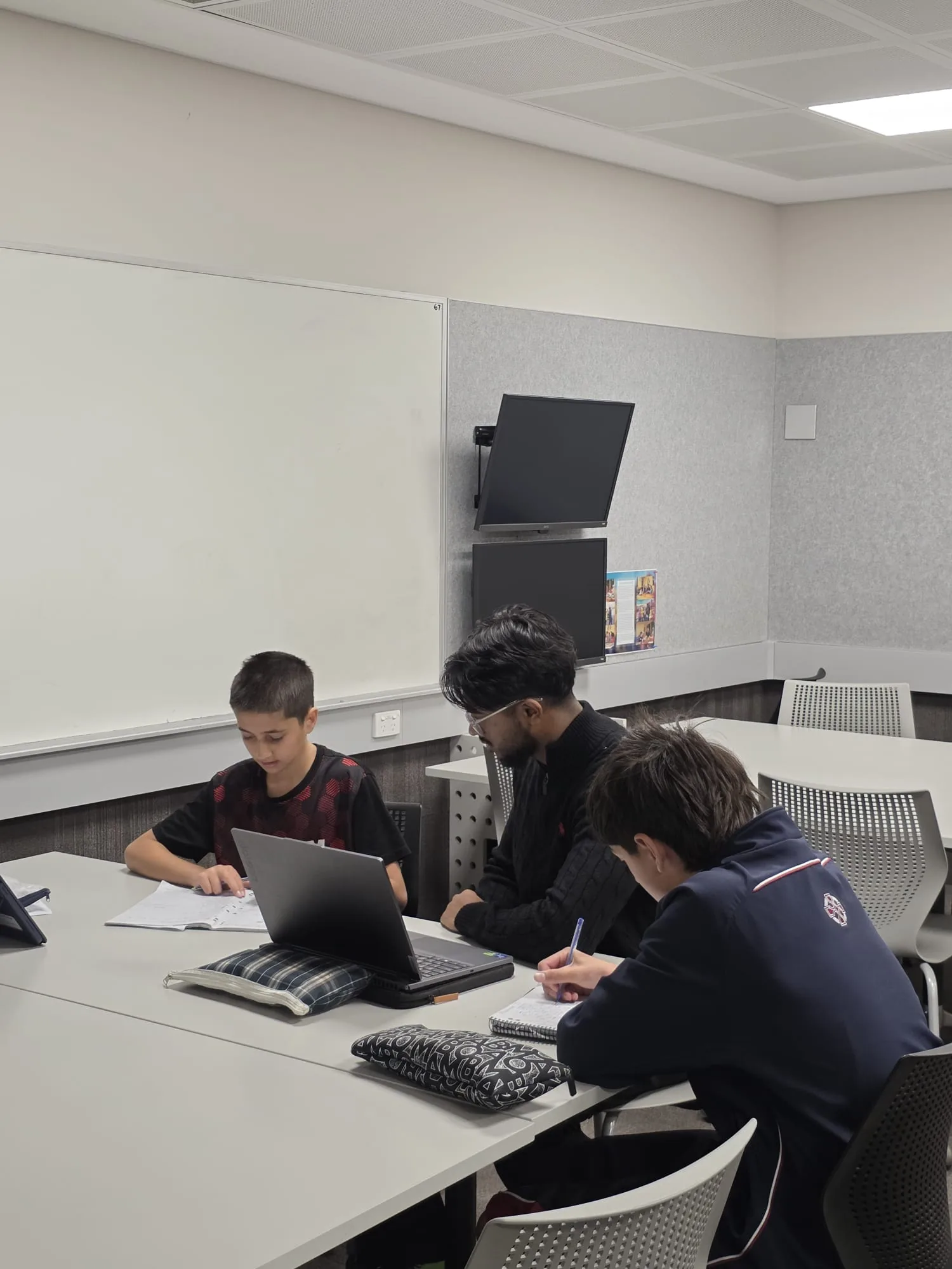 Aventus tutor giving personalised support during a small group lesson